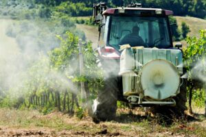 Tractor,Spraying,Weed,Killer,In,A,Vineyard